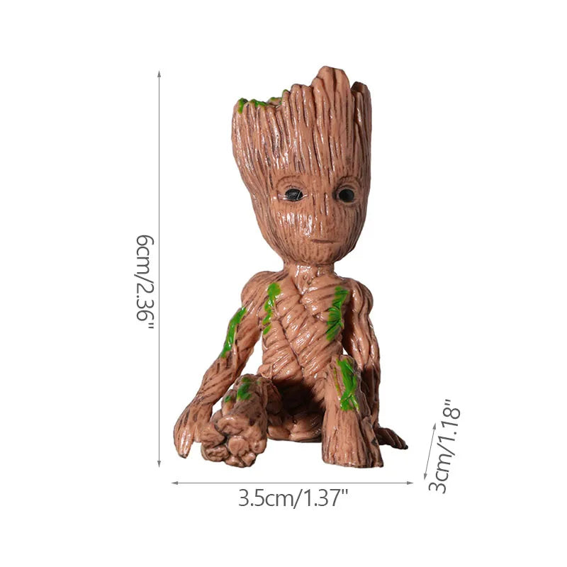 Figura decorativa de árbol infantil marrón con detalles verdes, medidas 6x3.5x3 cm