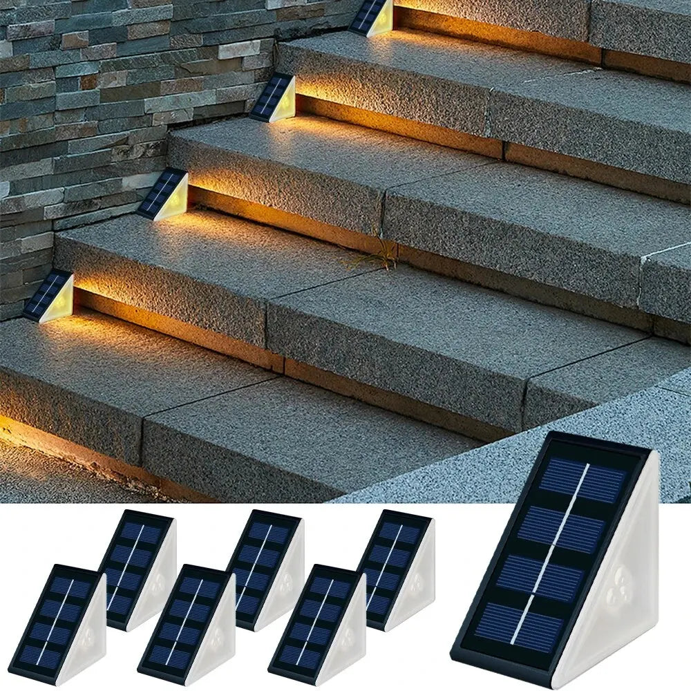 Luces LED solares para escaleras exteriores iluminando escalones de piedra, diseño moderno